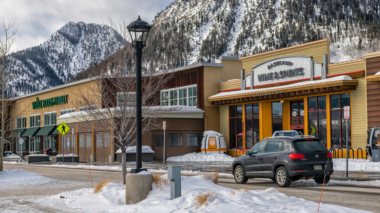 a Whole Foods Market with snow-covered mountains in the background in Colorado