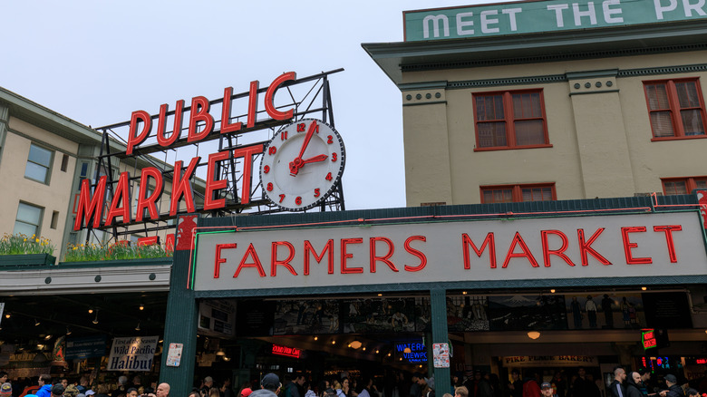 signs reading "public market" and "farmers market" above the Pike Place Market in Seattle, Washington