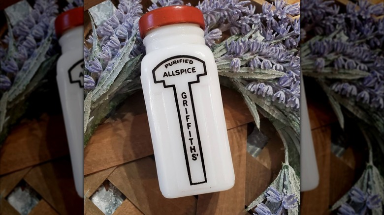 A vintage Griffiths' spice jar surrounded by dried lavender