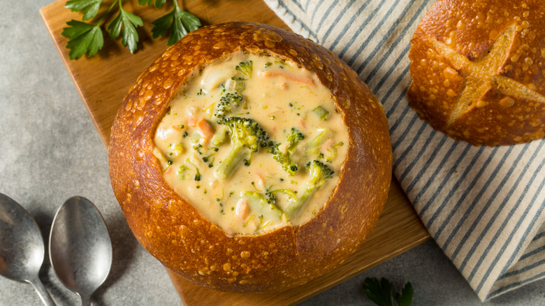 Broccoli cheddar soup served in a bread bowl