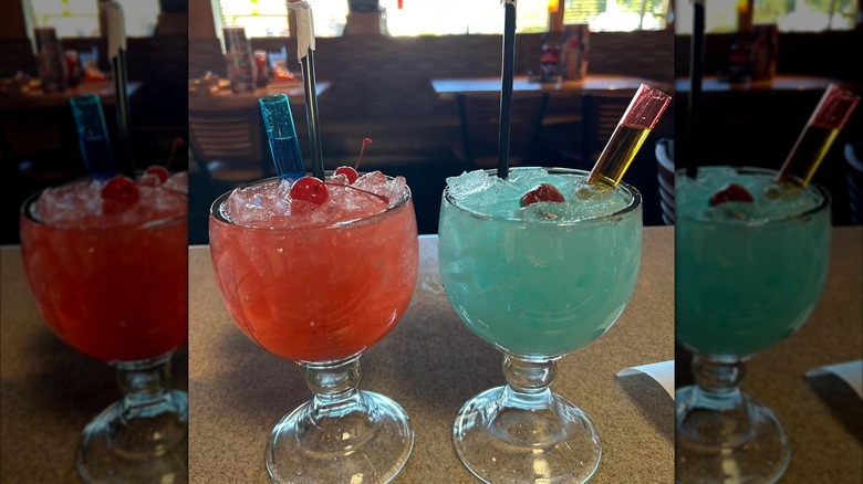 Red and blue cocktails with cherries on top from Applebee's.