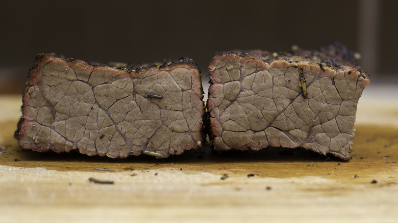 Overcooked beef on cutting board