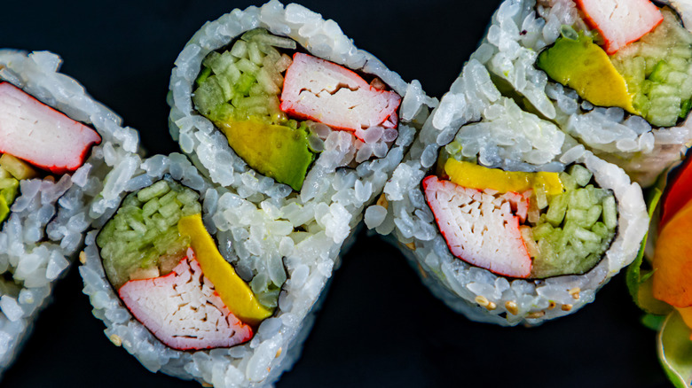 California roll sushi close-up on black background