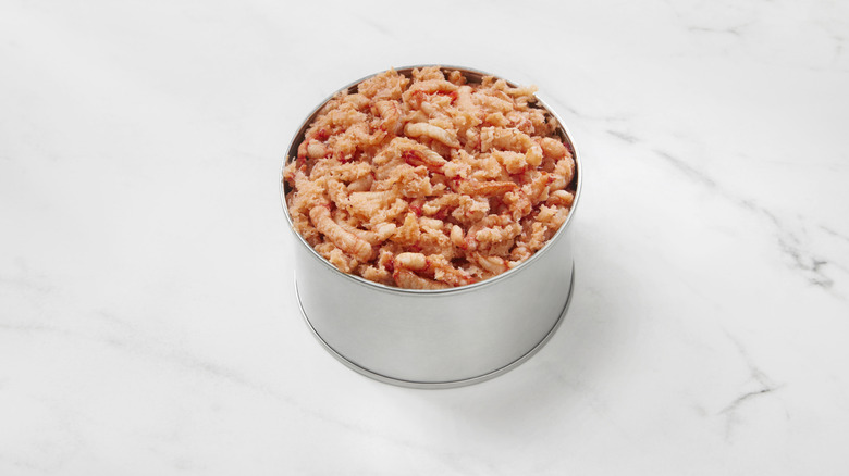 Canned lobster meat on an isolated countertop