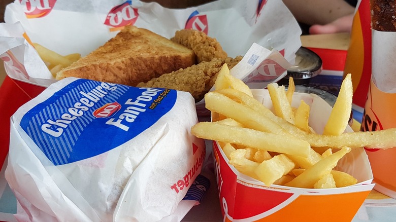 Dairy Queen chicken basket, cheeseburger, and a side of fries