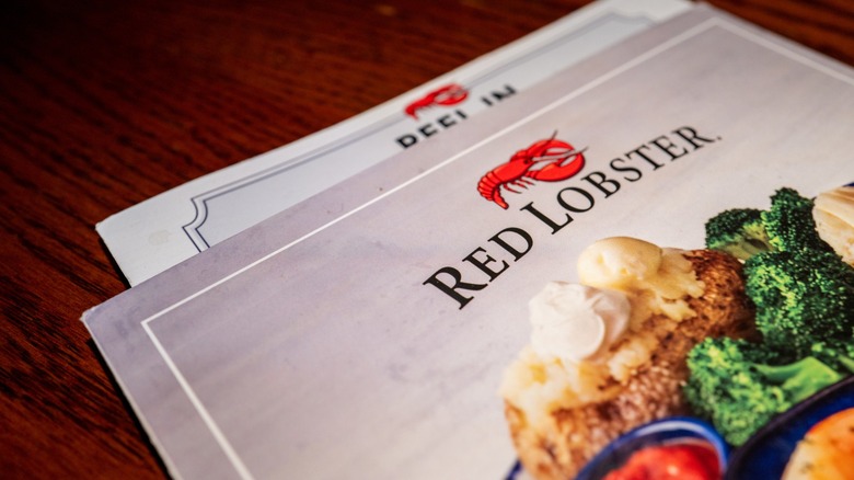 The top of a Red Lobster menu featuring an image of a baked potato and broccoli