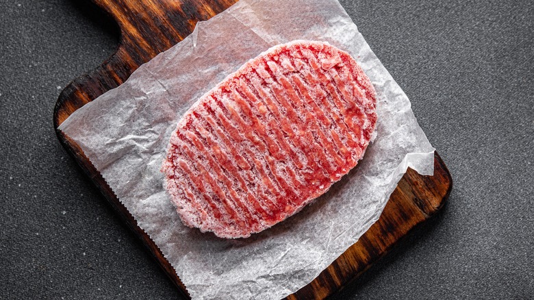 frozen meat on cutting board