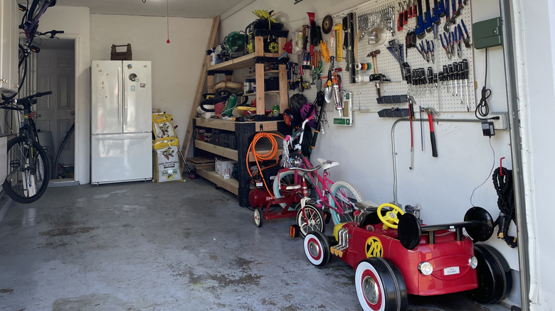 An old refrigerator in a garage