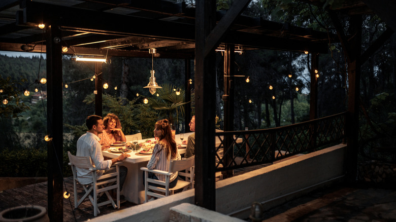 People dining outside in the evening