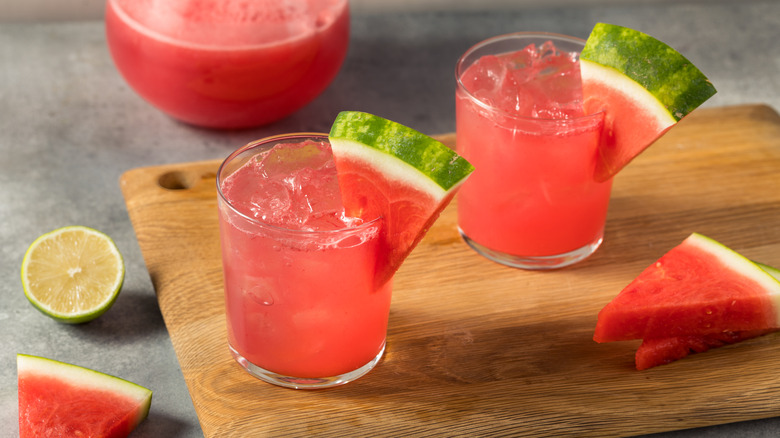 watermelon cocktails on wood board with lime