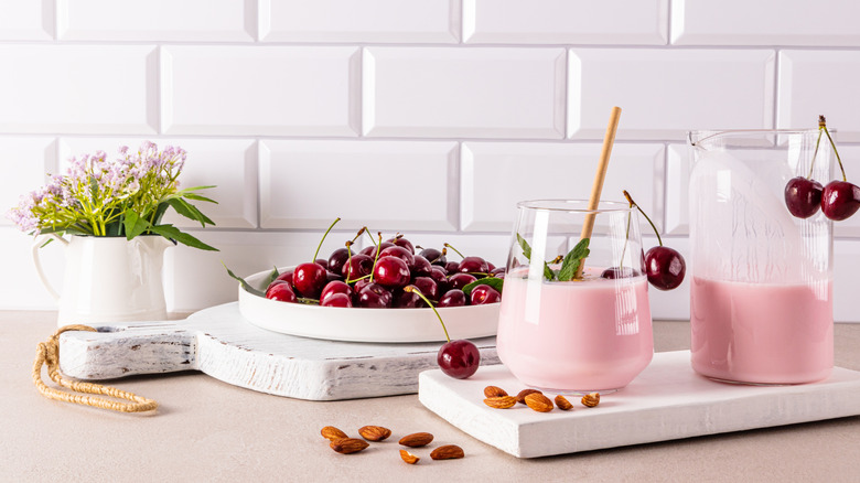 cherry smoothies in a glass with fruit
