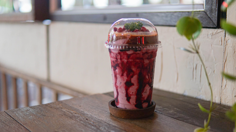 cherry smoothie with chocolate and fruit on top