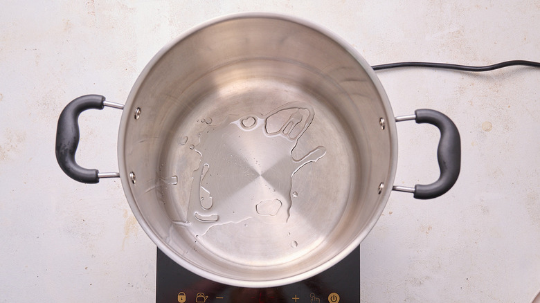 heating oil in a pot