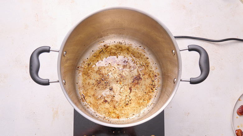 sausage drippings reserved in pot