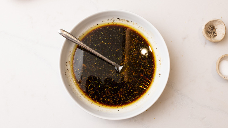 3-ingredient steak marinade in shallow dish with fork