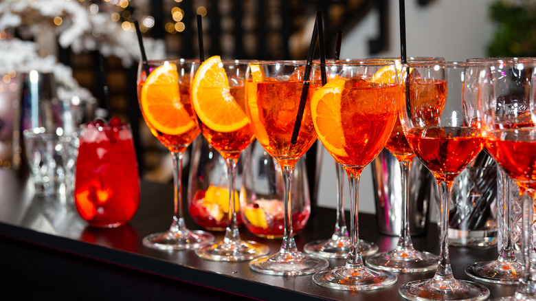 Line of spritz cocktails on bar