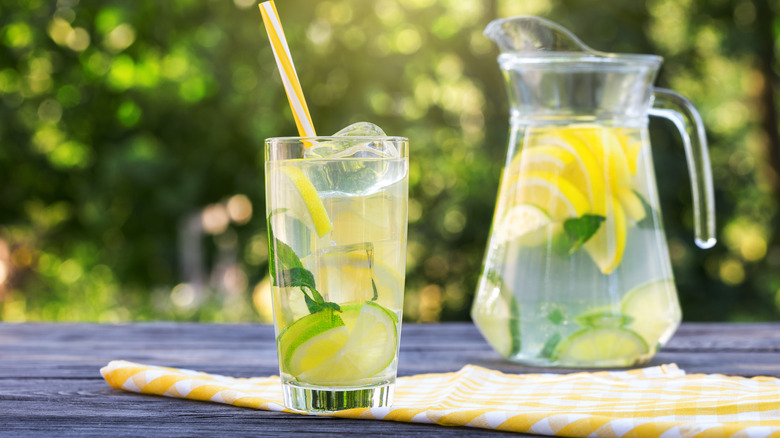 Pitcher of lemonade with mint and limes