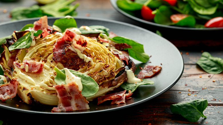 Roasted cabbage with bacon pieces and spinach