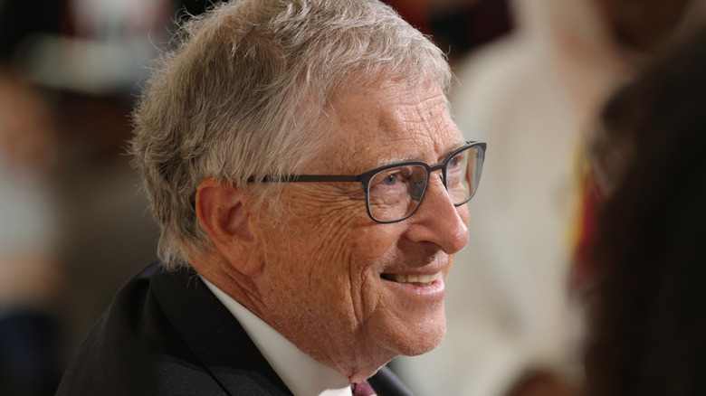 Bill Gates looking to the side and smiling
