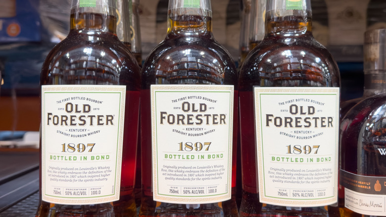 Several bottles of Old Forester Kentucky straight bourbon whiskey, bearing "bottled in bond" on the label