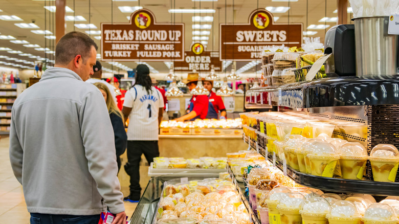 People shop in the prepared food section of Buc-ee's