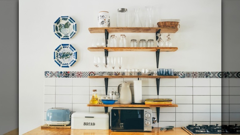 wall decorated with blue plates