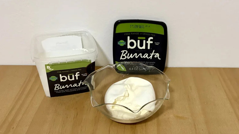 Buf burrata in a bowl on wood table