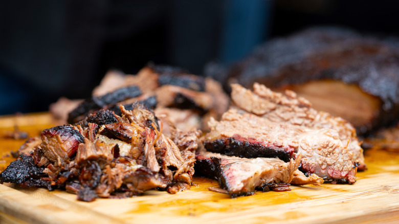 Soft, pulled brisket on a cutting board