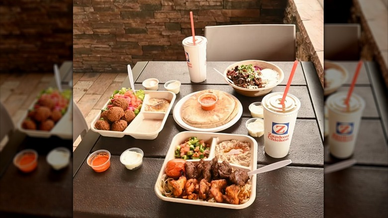 Chicken meals on table with extra sauces