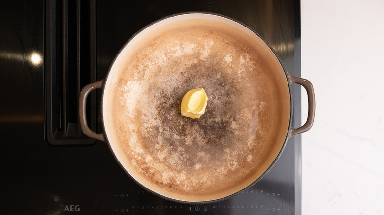 Butter in large pan on stovetop