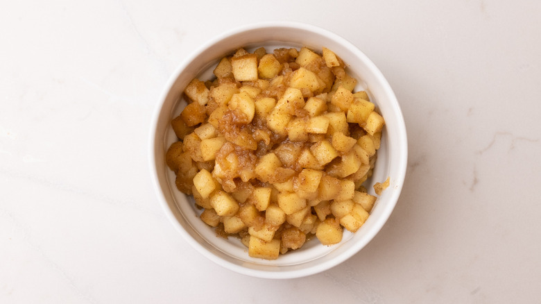 cooked apple cooling in bowl