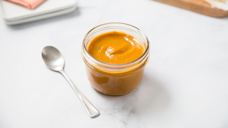 BBQ sauce served on table