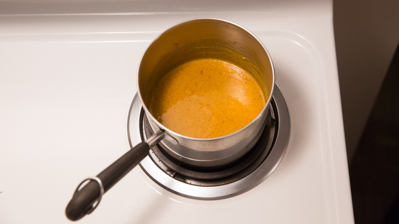 BBQ sauce heating on stove
