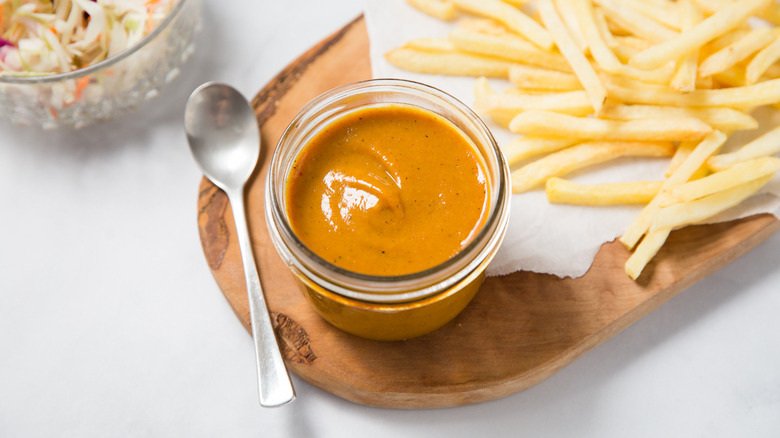 BBQ sauce served on table