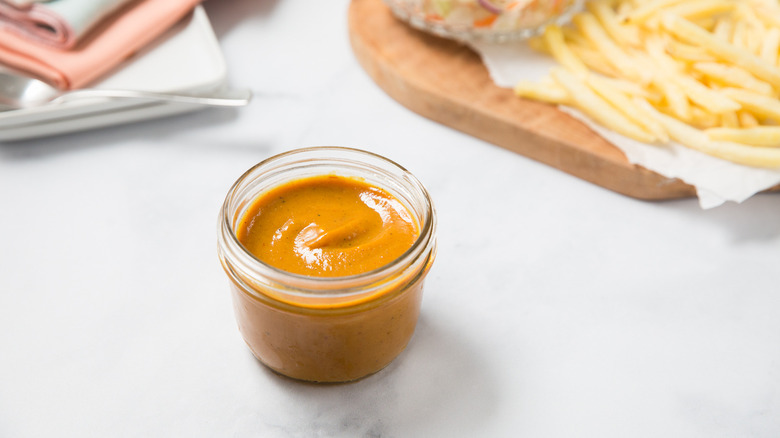 BBQ sauce served on table