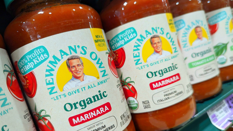 Jars of Newman's Own marinara sauce on shelves