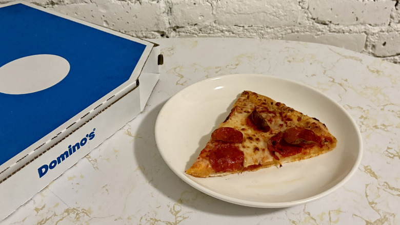 Domino's pepperoni pizza on a plate