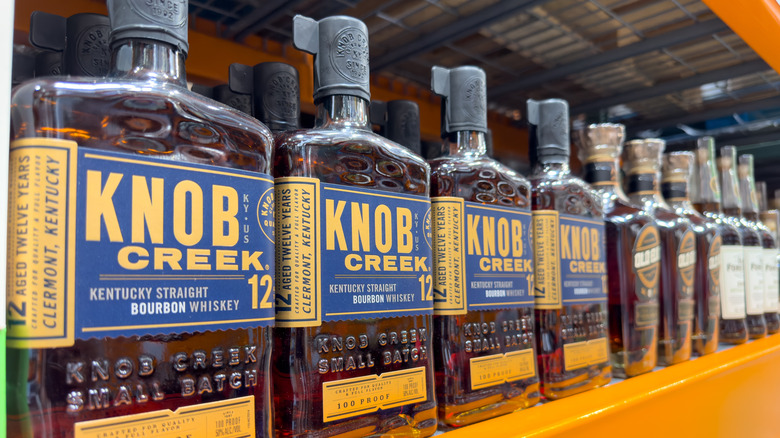Bottles of Knob Creek 12 whiskey on Costco shelf.
