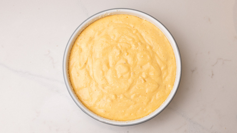 unbaked souffle batter in baking dish on marble surface