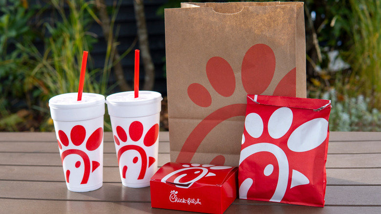Chick-fil-A food on the table on the green bush background