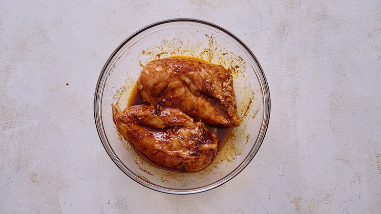 bowl of marinated chicken
