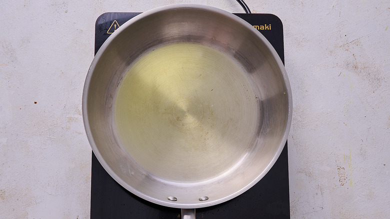 heating oil in a skillet