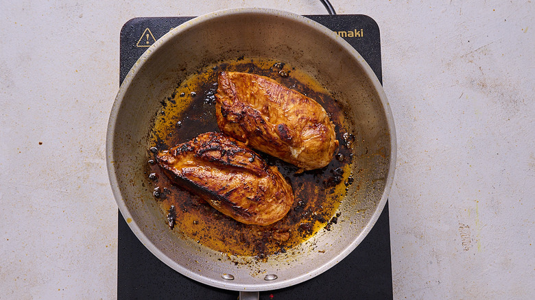 cooking chicken in a skillet