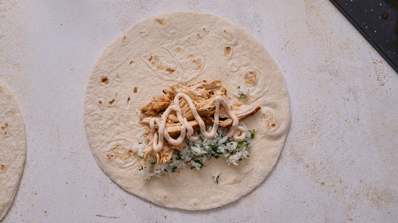 tortilla filled with chicken and rice