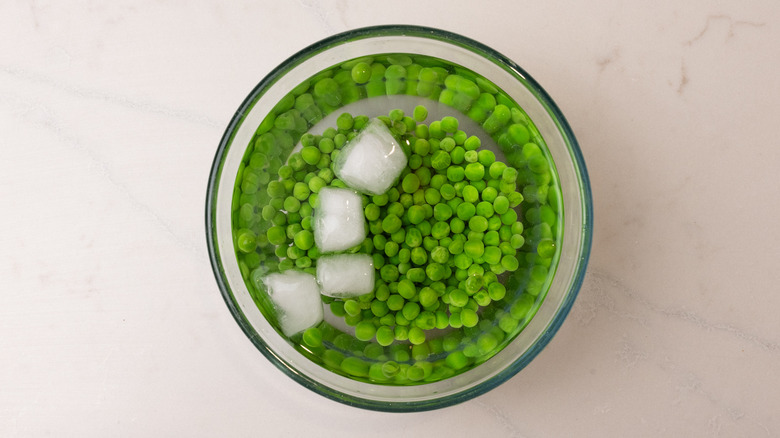 Garden peas in ice bath