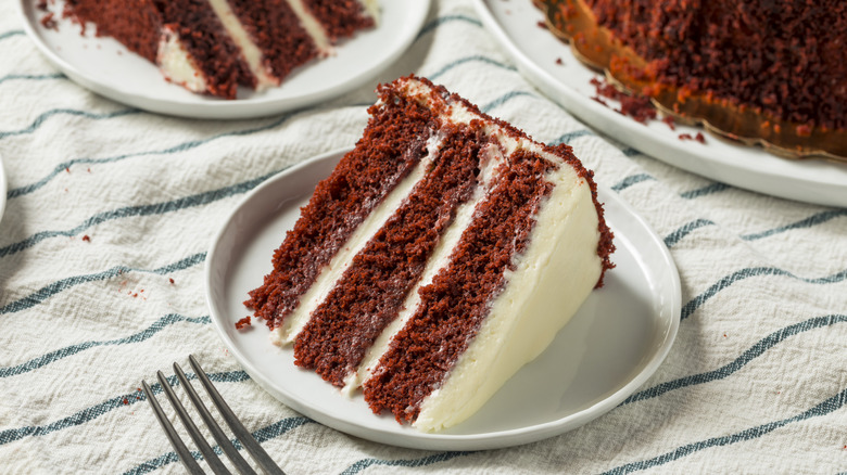 slice of layered mahogany cake with white icing