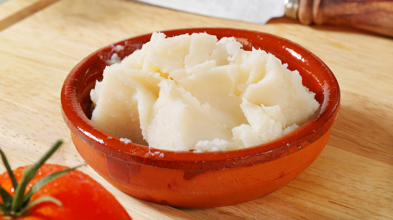 Lard in a red ceramic bowl