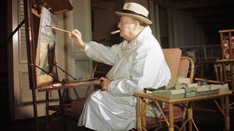 Winston Churchill painting while smoking