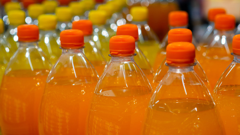 Rows of orange soda and citrus soft drinks