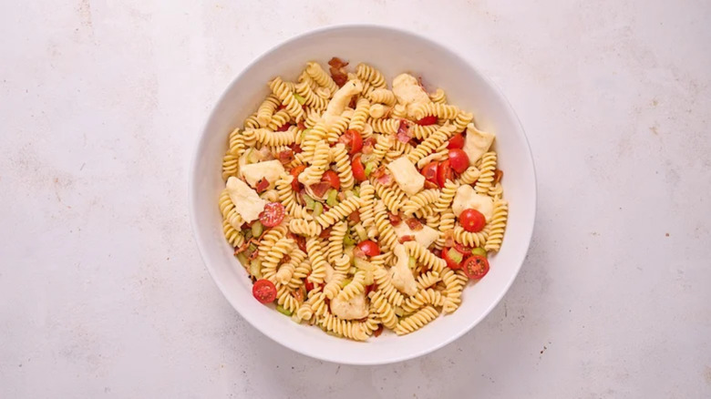 bloody mary pasta salad in a bowl